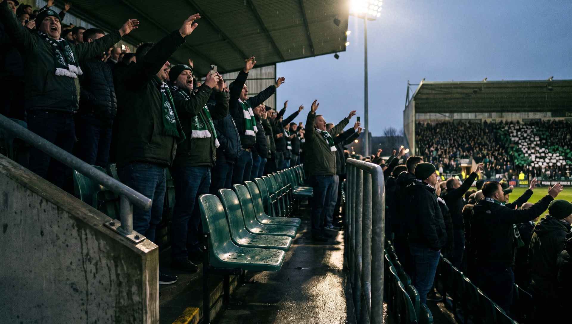 Supporter in a green club scarf tapping a phone ticket on a stadium turnstile reader