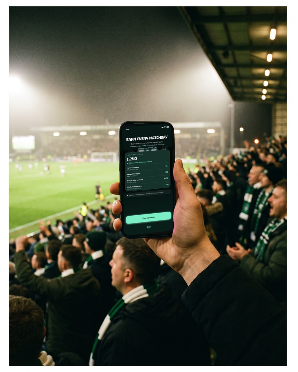 A supporter tapping a wallet pass at a floodlit stadium turnstile